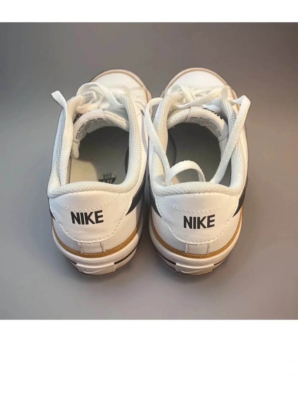 Nike White Low Top Sneakers with Black Swoosh and Brown Rubber Sole 6.5Y